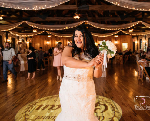 Bride about to toss her bouquet at The Springs Event Venue