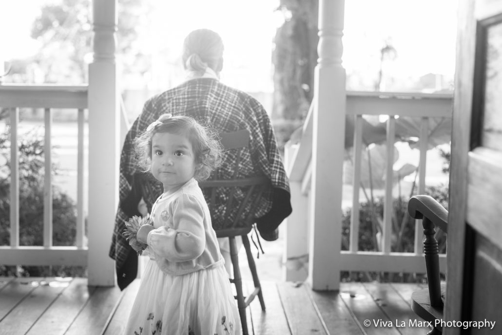 Katalina takes photos with her grandparents in Oak Tree Manor in Spring,Texas