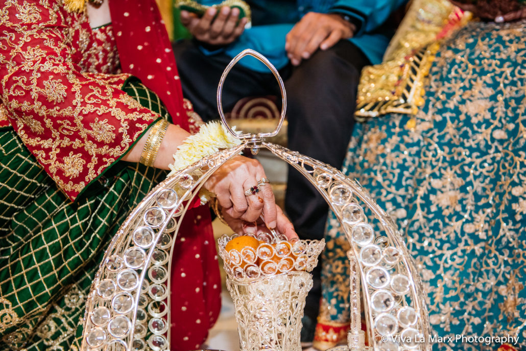 Feeding bride and groom at Houston Pakistani Wedding