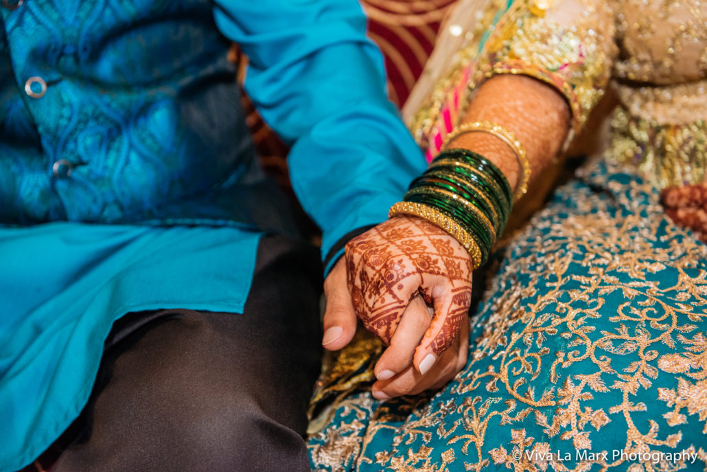 Holding hands at Houston Pakistani Wedding