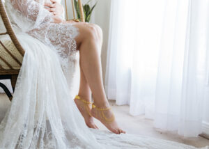Photo of feet with jewelry on during a boudoir session